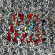 Chainmail expansion with idle rings to expand or contract.