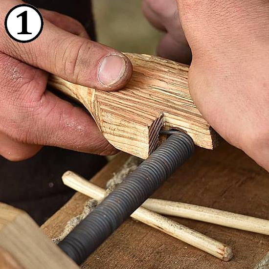 Coiling wire into a spiral for making riveted chainmail rings.