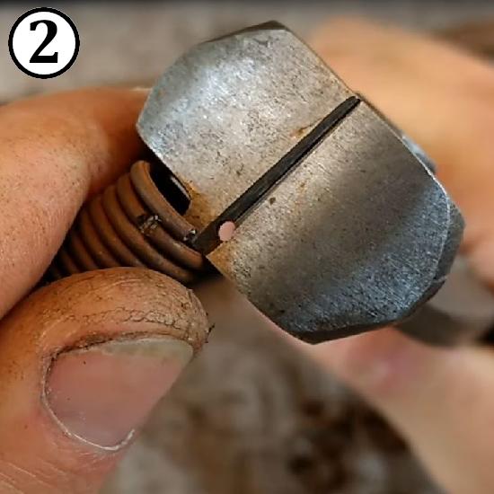 Cutting rings off a spiral for making riveted chainmail rings.