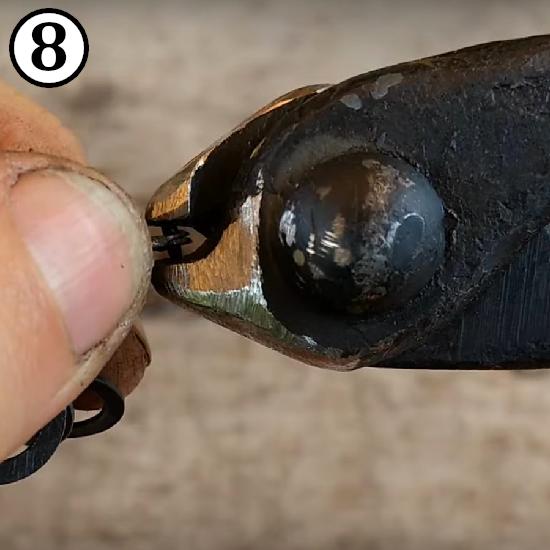 Setting a rivet in a ring for making riveted chainmail rings.