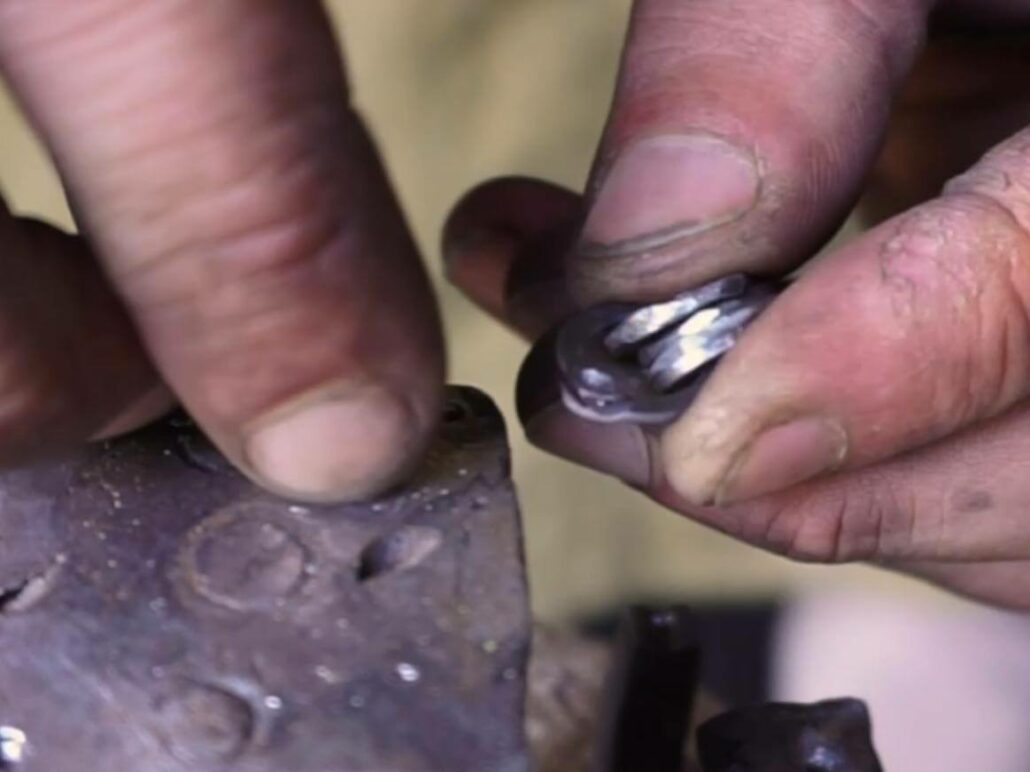 Four Solid Rings Inside A Riveted Ring